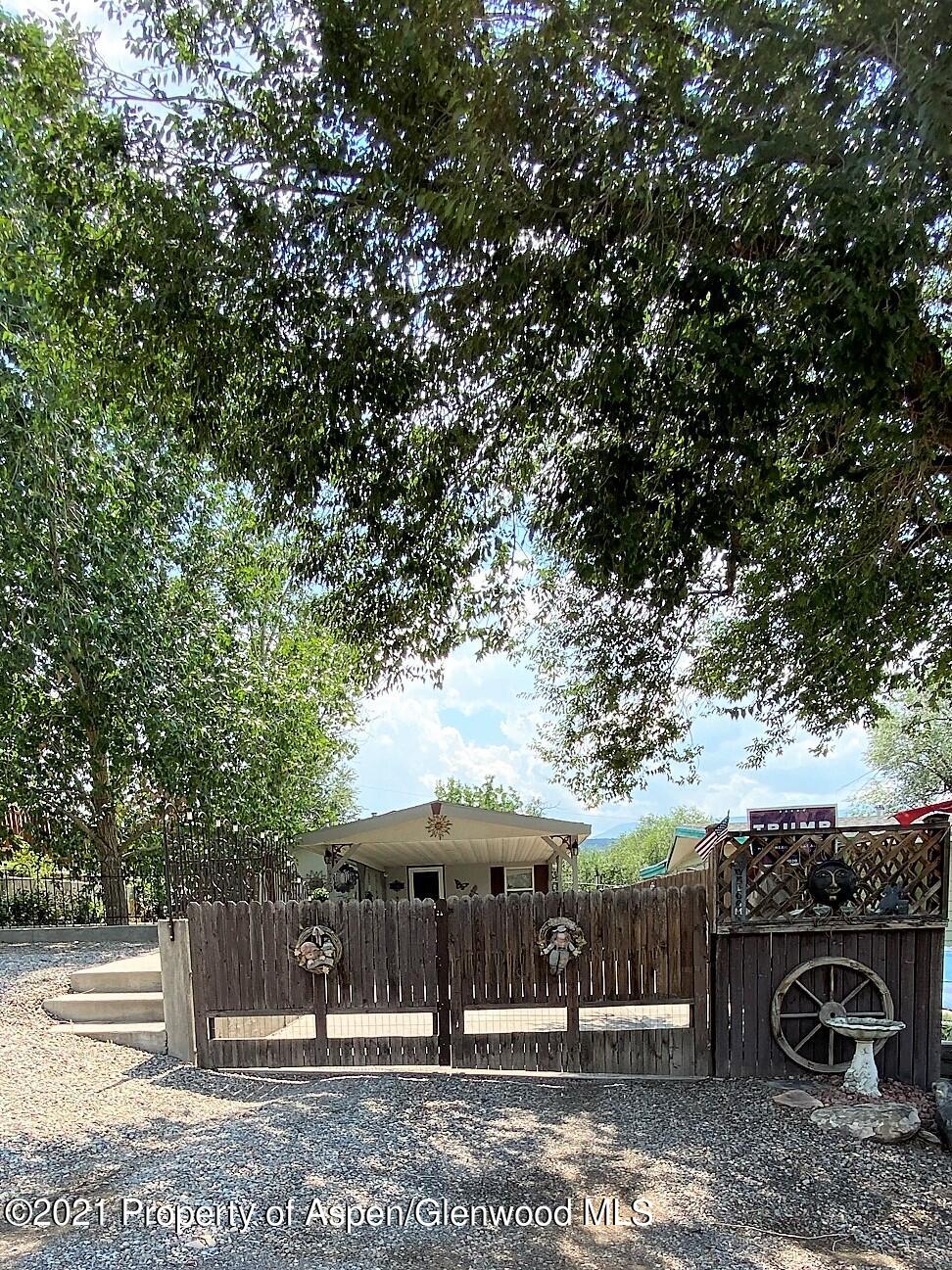 429 East 4th Street Rifle, CO 81650 - Photo 5 of 29 a view of a patio with furniture and a fire pit