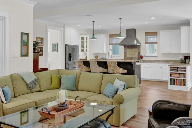 a kitchen with granite countertop a sink stainless steel appliances and cabinets