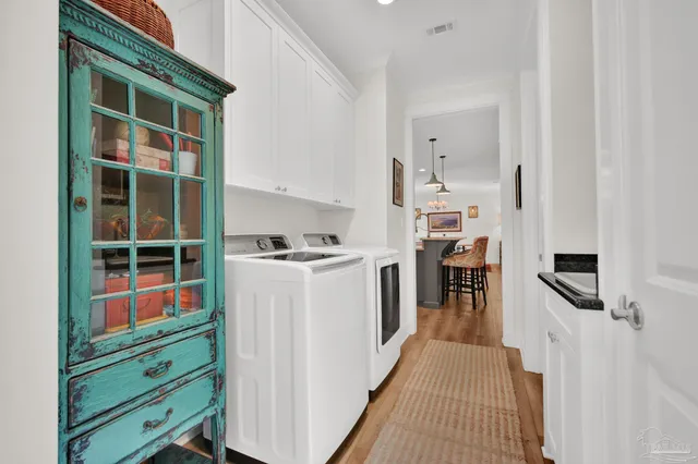 a living room with furniture a ceiling fan and a window