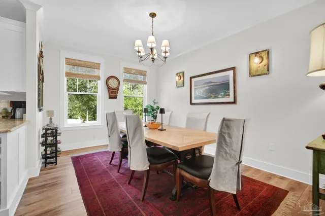 a view of a bedroom with furniture and wooden floor