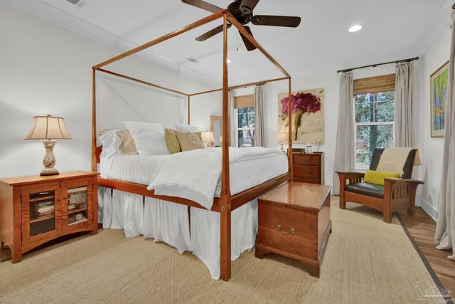 a bed room with a bed and a chair