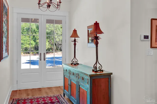 a living room with furniture wooden floor and a fireplace