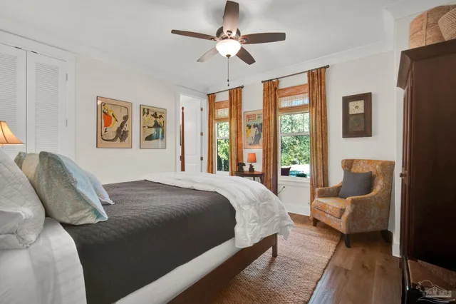 a view of a workspace with furniture and a flat screen tv