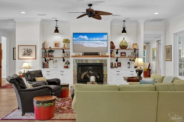a living room with furniture and a fireplace