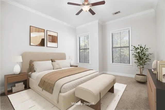 a spacious bedroom with a bed and a window