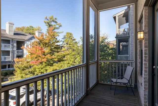 a view of a balcony with wooden floor