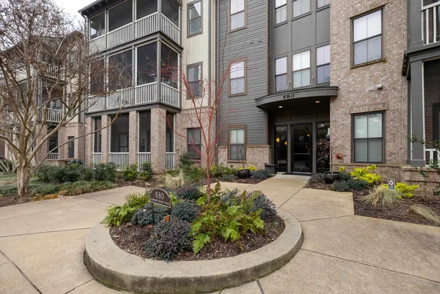 a view of a building with potted plants