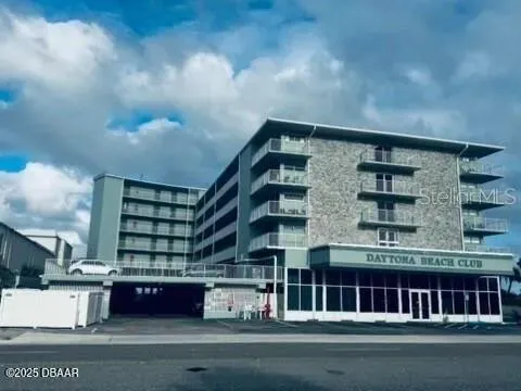 a front view of a building with garden