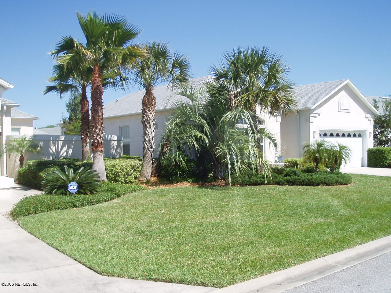 169 Cedar Ridge Circle St. Augustine, FL 32080 - Photo 2 of 5 a front view of a house with a garden and yard