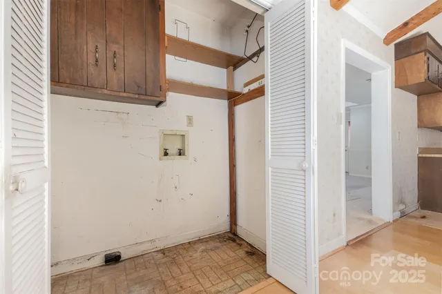 a view of an entryway with wooden floor