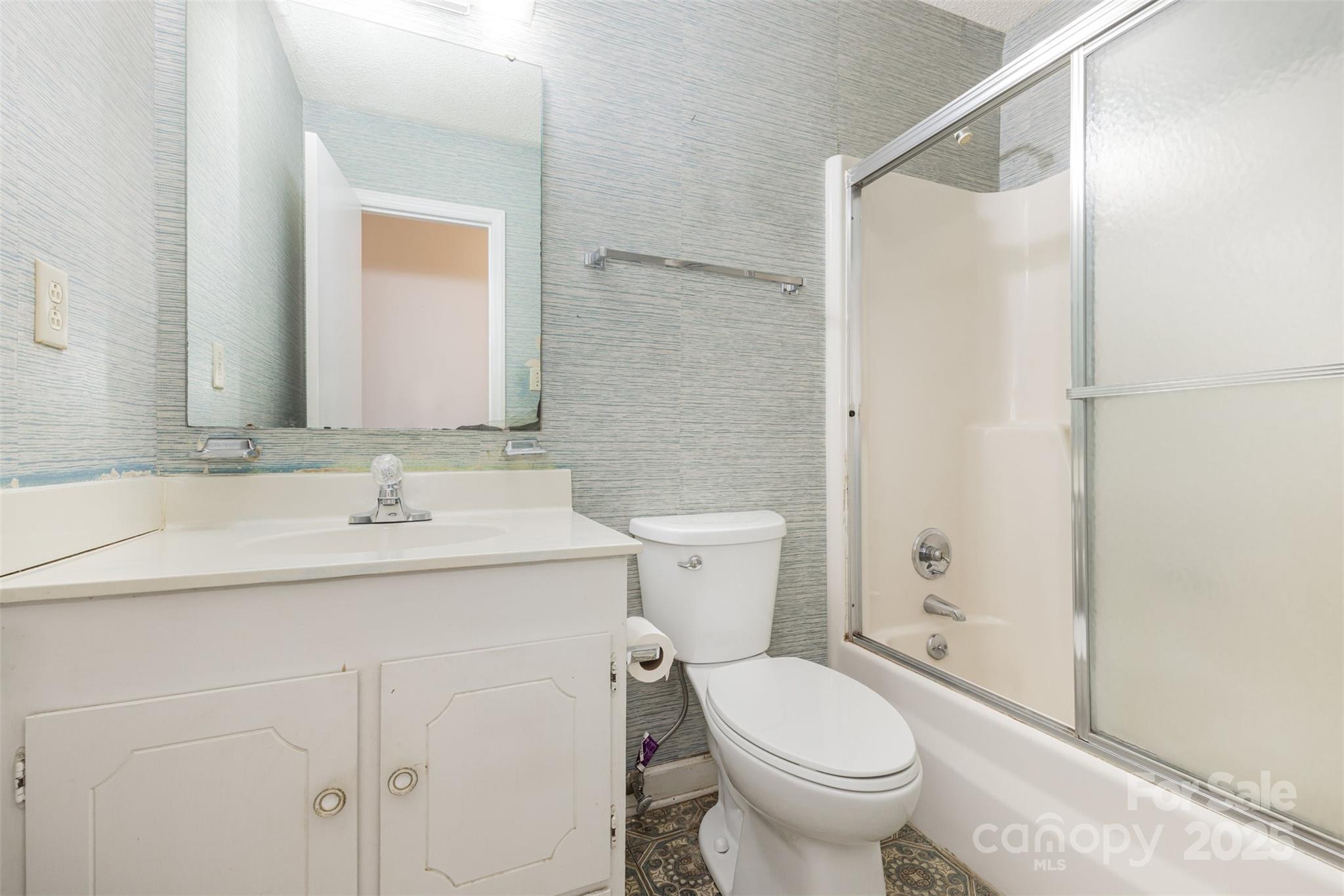 7428 Bradgate Road Charlotte, NC 28217 - Photo 21 of 27 a bathroom with a granite countertop toilet sink and a mirror
