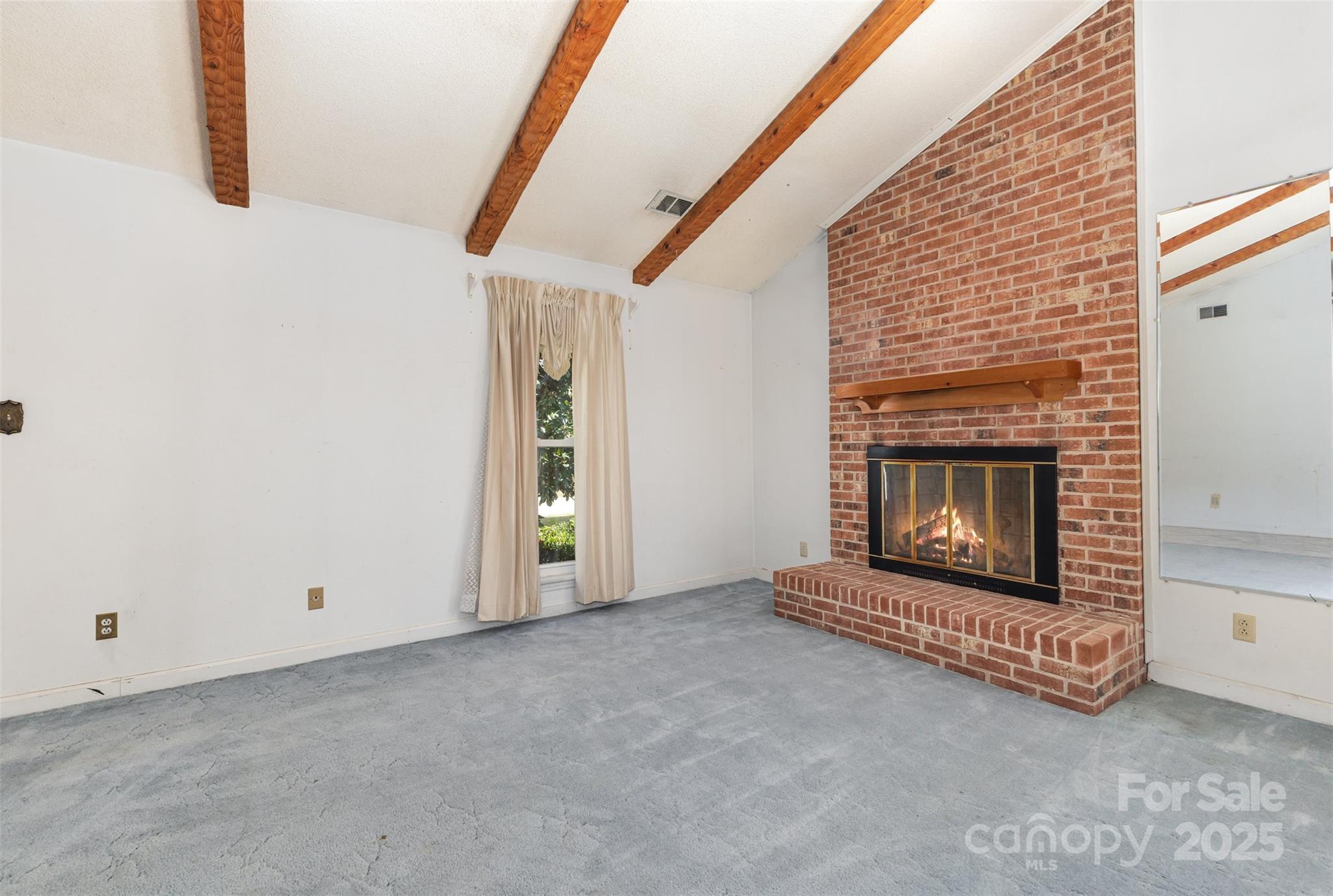7428 Bradgate Road Charlotte, NC 28217 - Photo 8 of 27 a view of empty room with fireplace