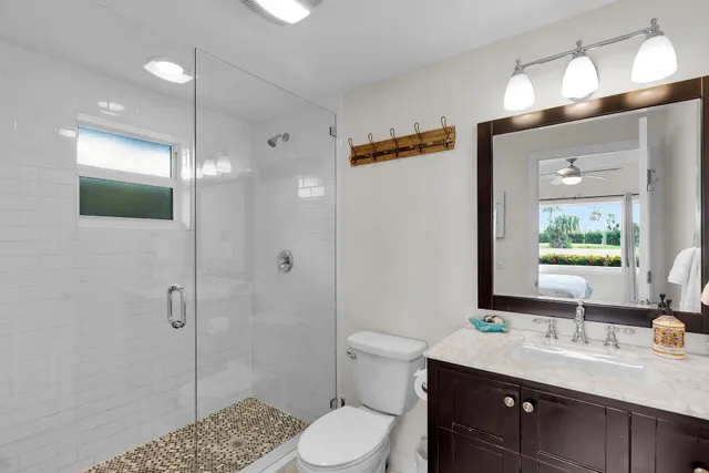 a bedroom with a bed and a flat screen tv in it