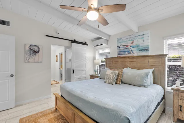 a bathroom with a shower sink vanity and mirror
