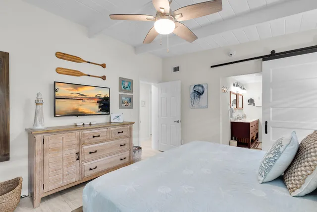 a bathroom with double vanity sinks and a mirror
