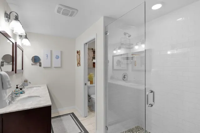 a bedroom with a bed and wall painting