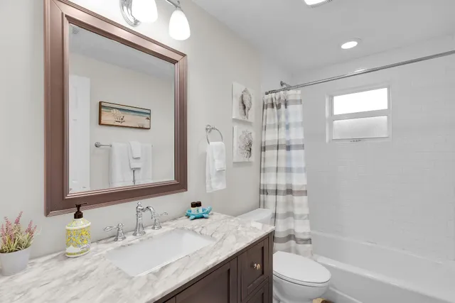 a view of roof deck with chairs and floor to ceiling window