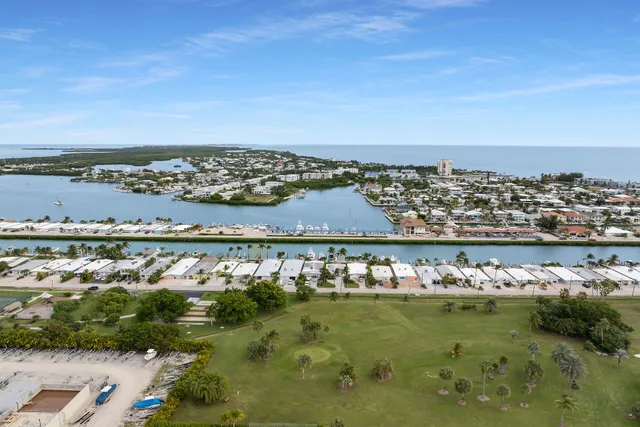 a view of a patio with chairs and a table