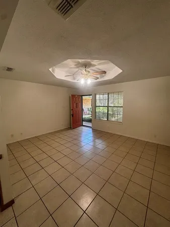 a view of an empty room and window