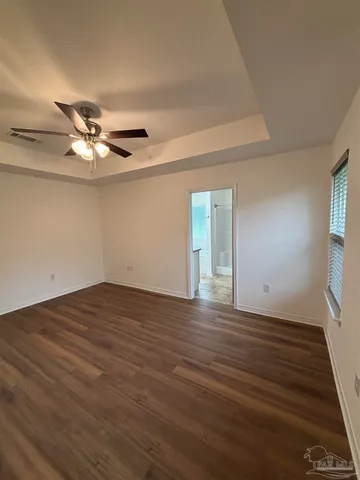 a bathroom with a granite countertop double sink and a mirror