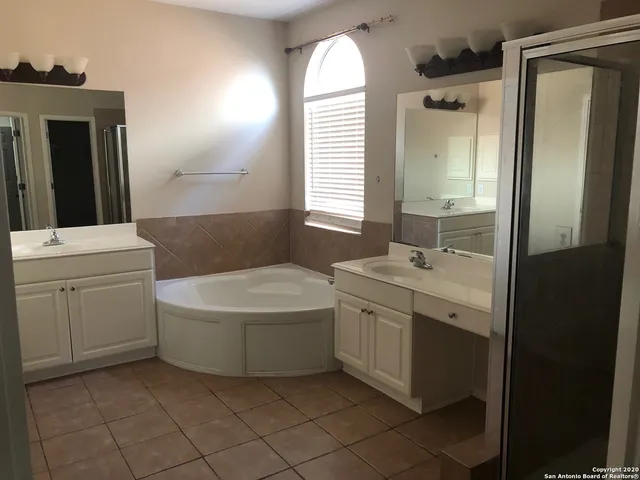 a view of a hallway view with wooden floor and staircase