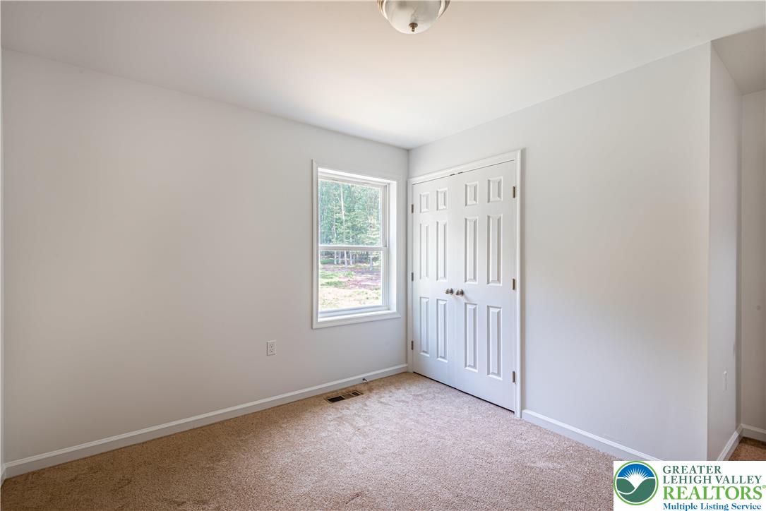 117 Cress Drive Effort, PA 18330 - Photo 11 of 29 an empty room with windows
