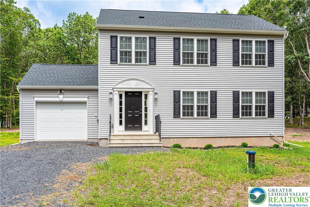 117 Cress Drive Effort, PA 18330 - Photo 2 of 29 a house view with a garden space