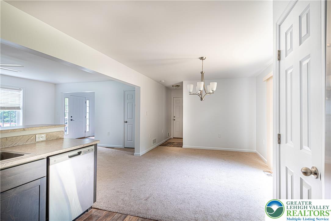 117 Cress Drive Effort, PA 18330 - Photo 8 of 29 a view of a kitchen with dishwasher and white cabinets