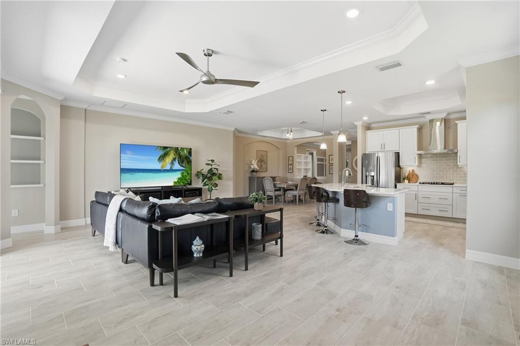 15194 Blue Bay Circle Fort Myers, FL 33913 - Photo 12 of 50 a living room with furniture and a flat screen tv