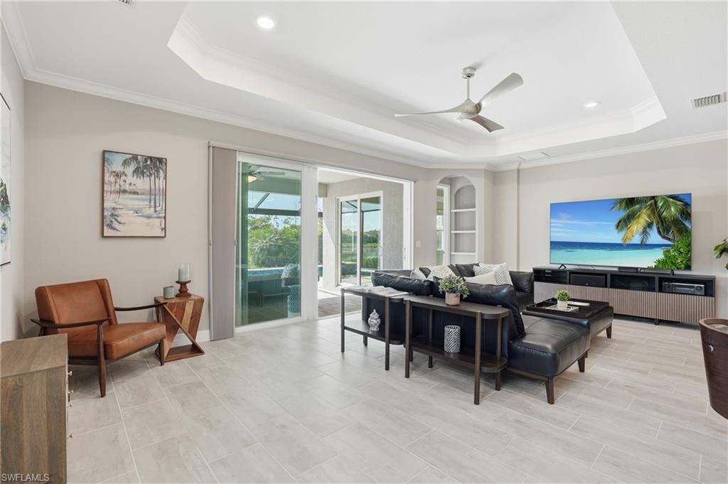 15194 Blue Bay Circle Fort Myers, FL 33913 - Photo 13 of 50 a living room with furniture and a flat screen tv