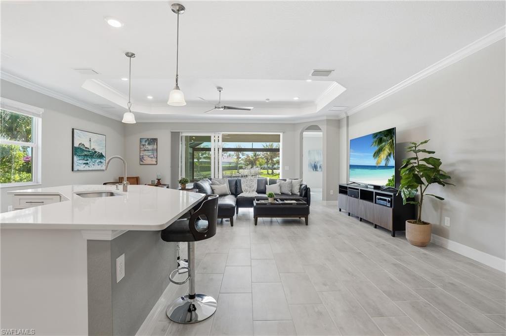 15194 Blue Bay Circle Fort Myers, FL 33913 - Photo 17 of 50 a living room with furniture a window and a flat screen tv