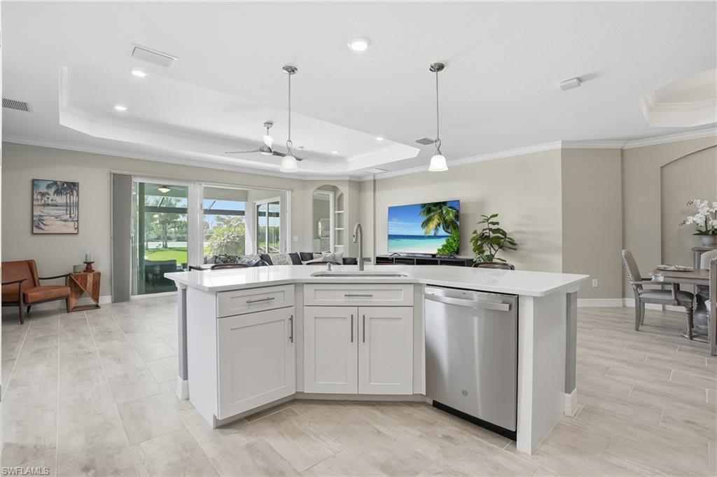 15194 Blue Bay Circle Fort Myers, FL 33913 - Photo 18 of 50 a kitchen with white cabinets and stainless steel appliances
