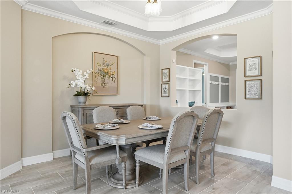 15194 Blue Bay Circle Fort Myers, FL 33913 - Photo 19 of 50 a dining room with furniture and window
