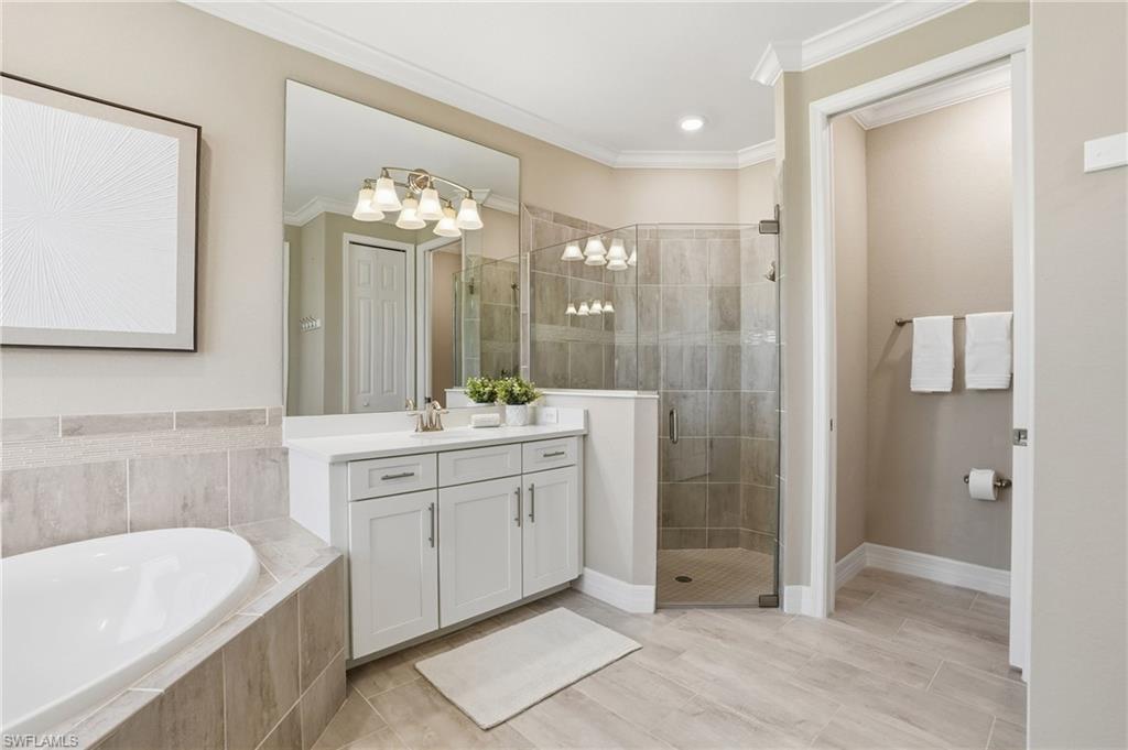 15194 Blue Bay Circle Fort Myers, FL 33913 - Photo 27 of 50 a bathroom with a double vanity sink mirror and shower