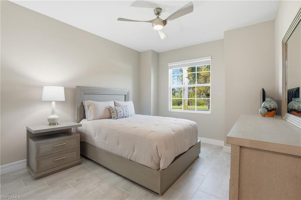15194 Blue Bay Circle Fort Myers, FL 33913 - Photo 28 of 50 a bedroom with a bed and a window