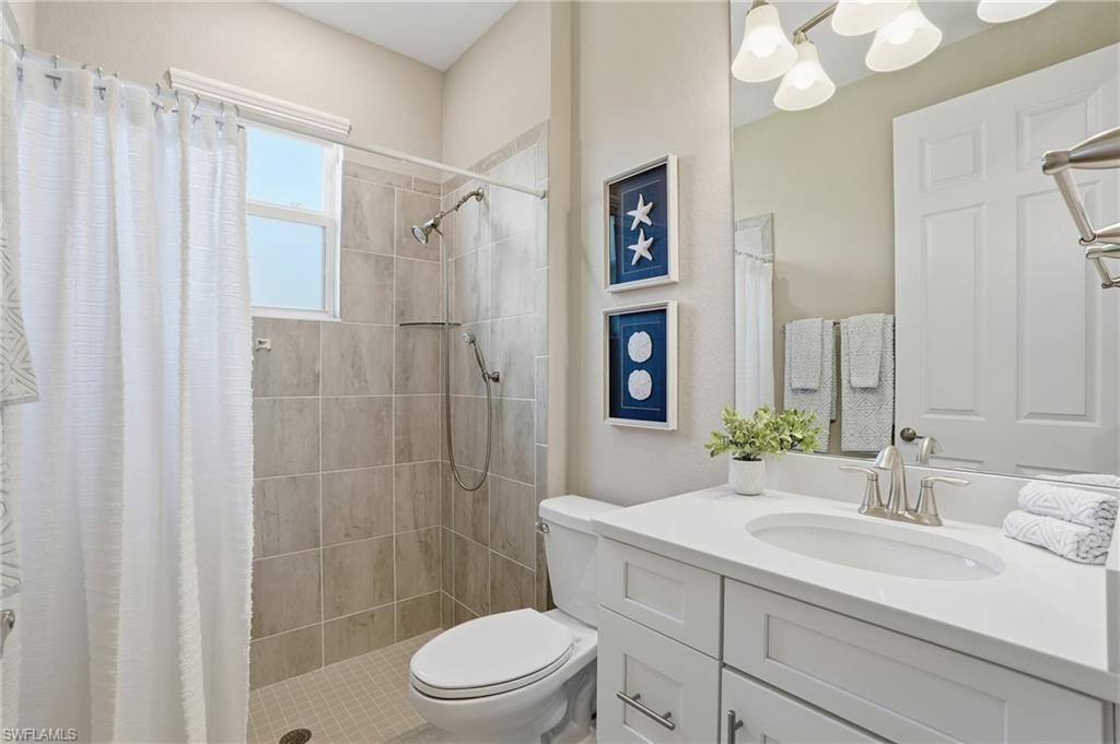 15194 Blue Bay Circle Fort Myers, FL 33913 - Photo 29 of 50 a bathroom with a sink a toilet and shower