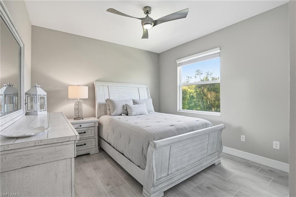 15194 Blue Bay Circle Fort Myers, FL 33913 - Photo 30 of 50 a bed room with a bed and a window