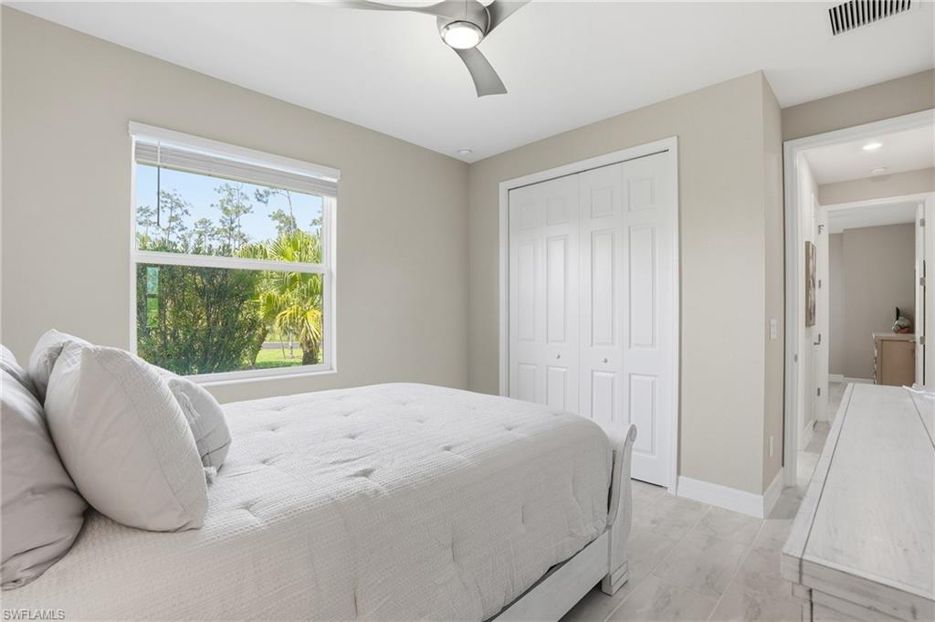 15194 Blue Bay Circle Fort Myers, FL 33913 - Photo 31 of 50 a bedroom with a bed and a window