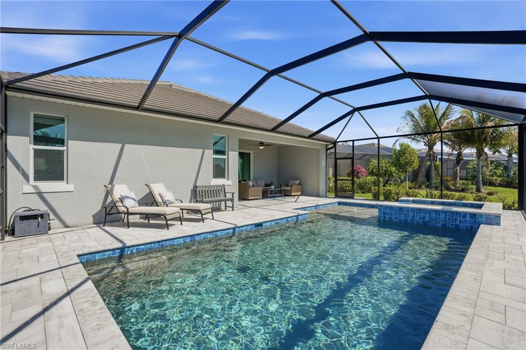 15194 Blue Bay Circle Fort Myers, FL 33913 - Photo 38 of 50 a view of a backyard with sitting area