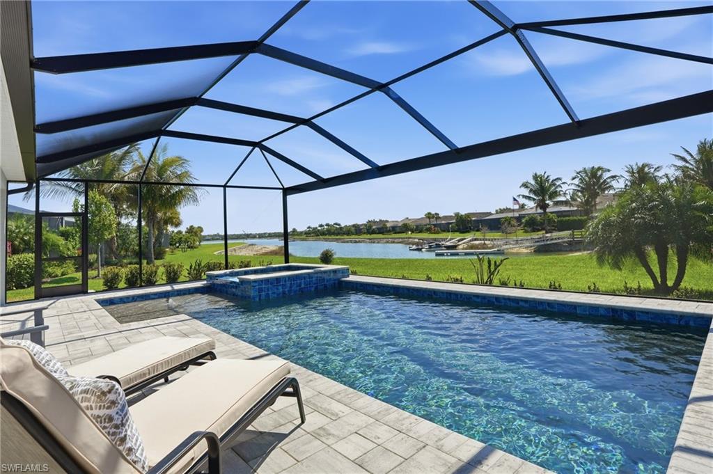 15194 Blue Bay Circle Fort Myers, FL 33913 - Photo 40 of 50 a view of a backyard with swimming pool and outdoor seating