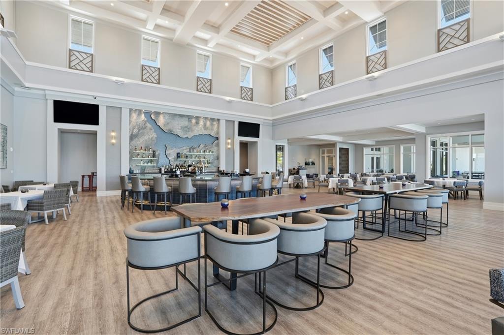 15194 Blue Bay Circle Fort Myers, FL 33913 - Photo 44 of 50 a dining hall with lots of wooden furniture and of stainless steel appliances