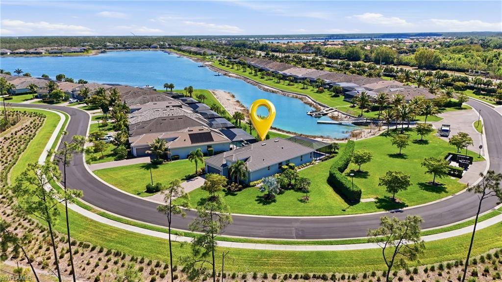15194 Blue Bay Circle Fort Myers, FL 33913 - Photo 5 of 50 an aerial view of a house with a garden and lake view