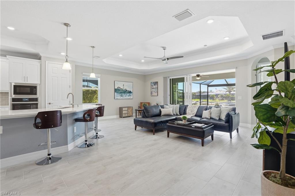 15194 Blue Bay Circle Fort Myers, FL 33913 - Photo 9 of 50 a living room with furniture and a potted plant