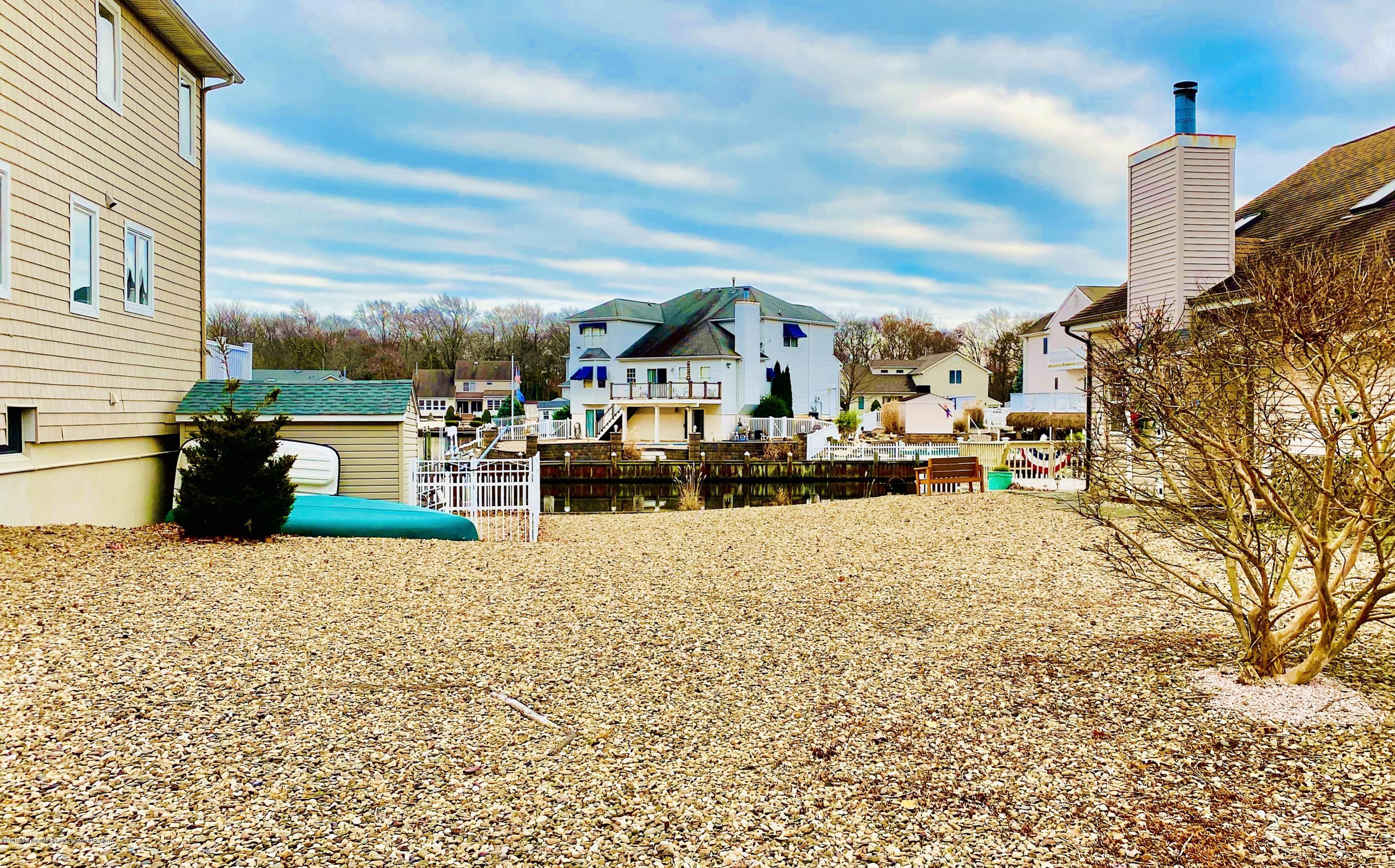 47 Dockage Road Bayville, NJ 08721 - Photo 2 of 19 a view of a terrace with wooden fence