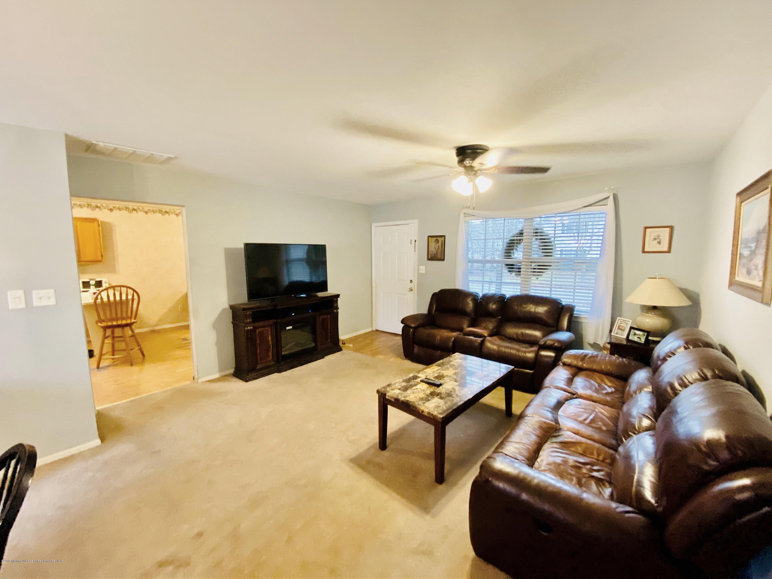 47 Dockage Road Bayville, NJ 08721 - Photo 3 of 19 a living room with furniture and a flat screen tv