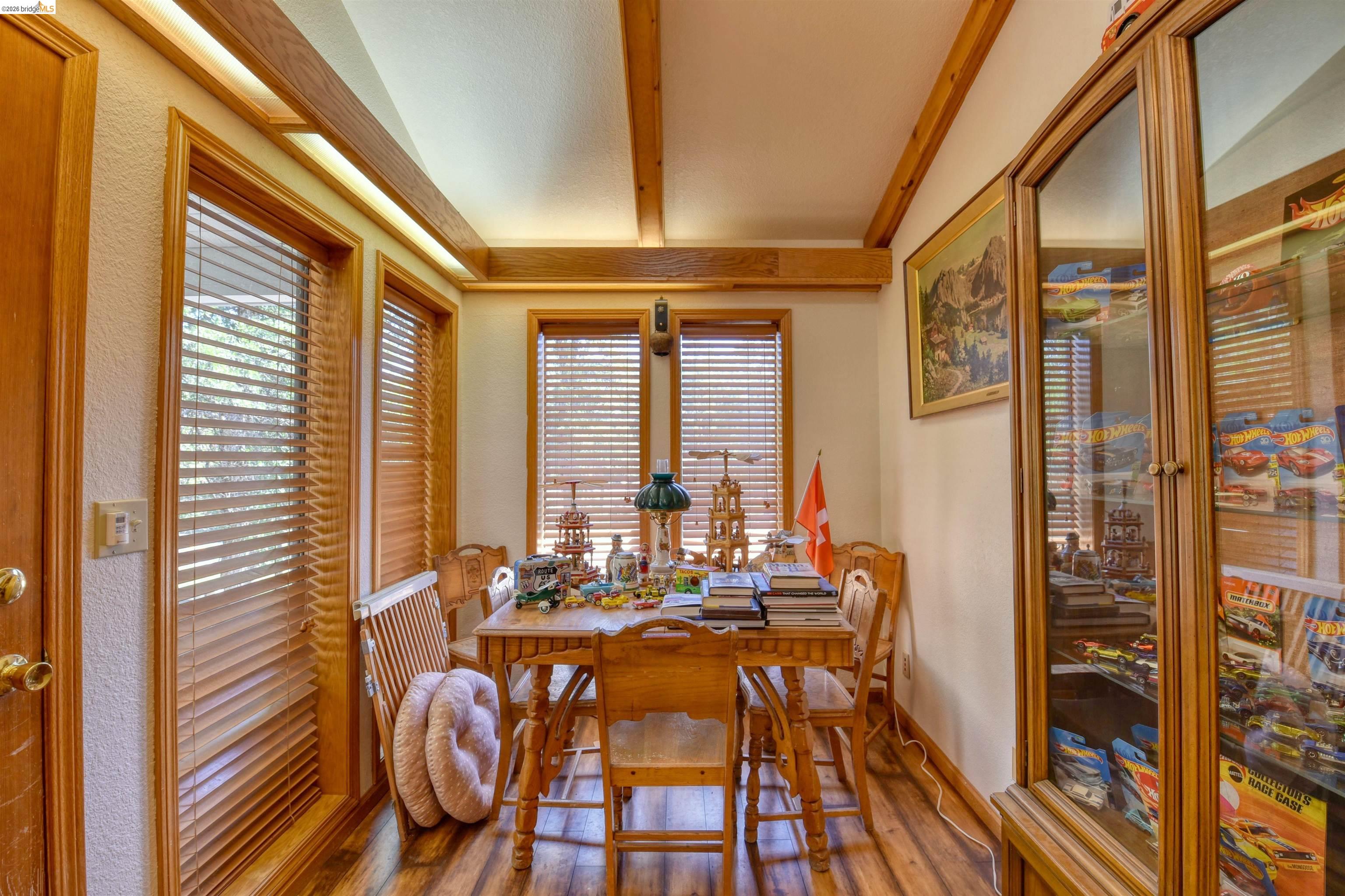 20950 Ferretti Road Groveland, CA 95321 - Photo 22 of 27 a view of a dining room with furniture window and wooden floor