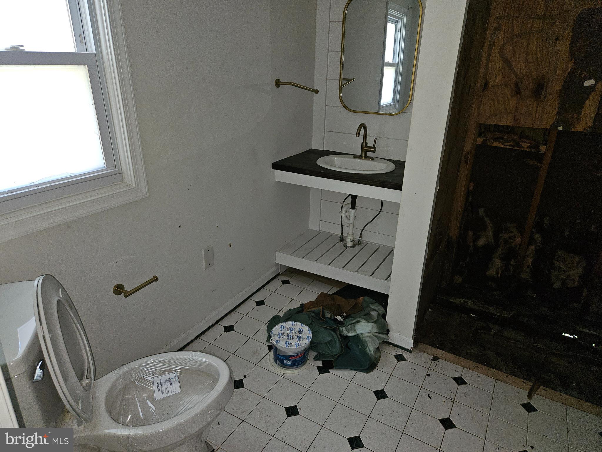 941 Conewago Creek Road Manchester, PA 17345 - Photo 13 of 22 a bathroom with a toilet a sink and mirror
