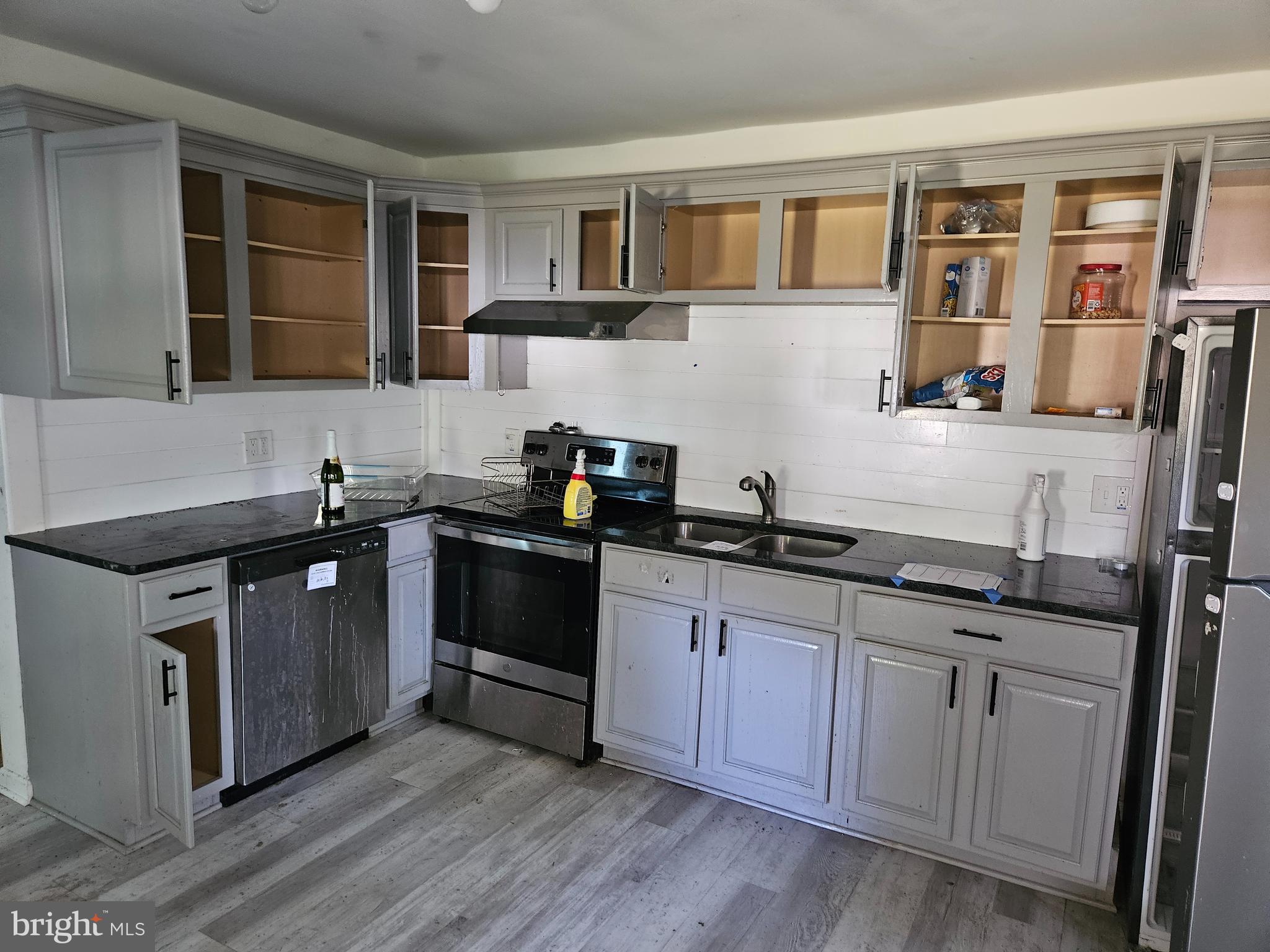 941 Conewago Creek Road Manchester, PA 17345 - Photo 18 of 22 a kitchen with stainless steel appliances granite countertop a sink stove and cabinets