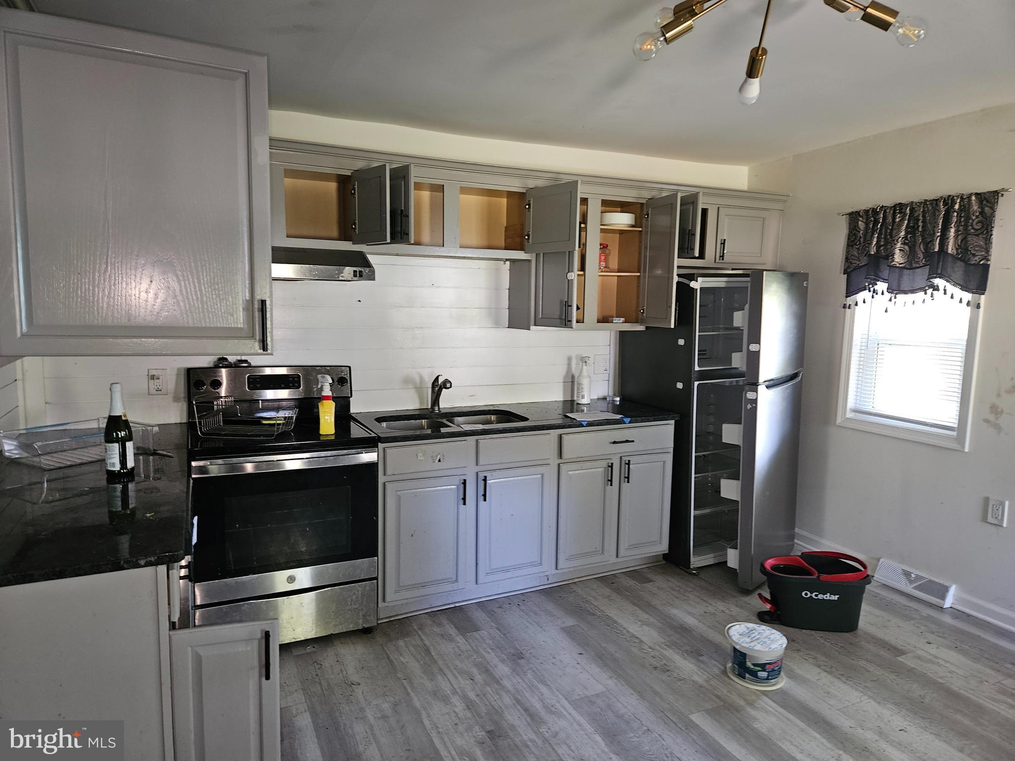 941 Conewago Creek Road Manchester, PA 17345 - Photo 19 of 22 a kitchen with a refrigerator and a stove top oven