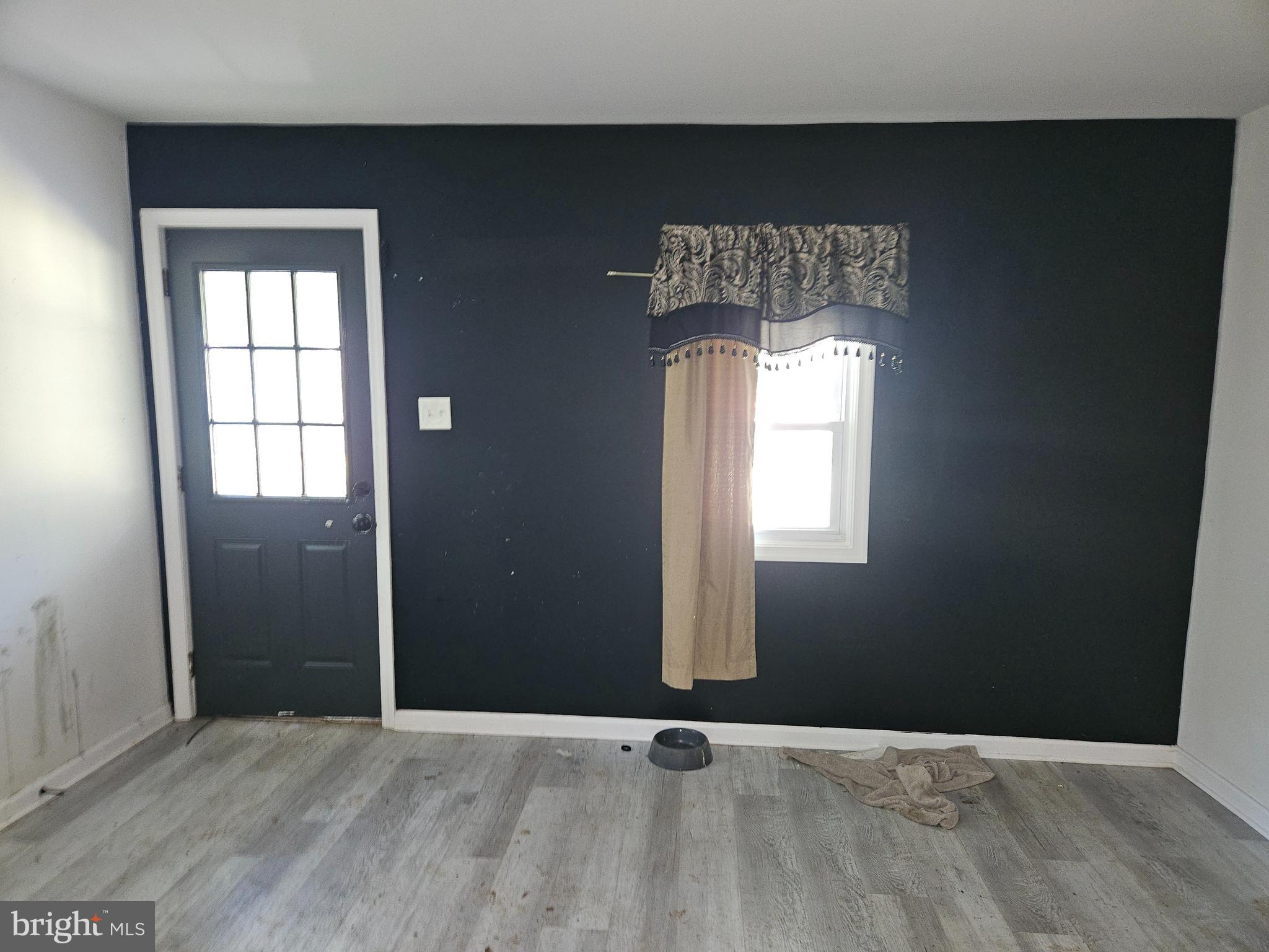 941 Conewago Creek Road Manchester, PA 17345 - Photo 20 of 22 an empty room with wooden floor and windows